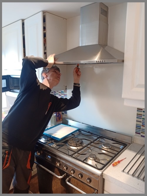 Kitchen hood installer in Birmingham preparing commercial extraction canopy